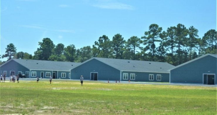 CCS Southport middle-school buildings and lawn, photographed in August 2022.