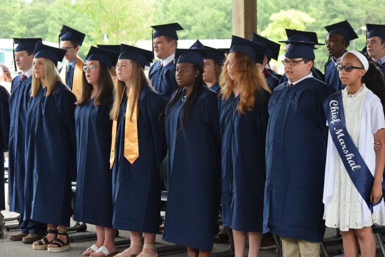 CCS Whiteville graduates in caps and gowns.